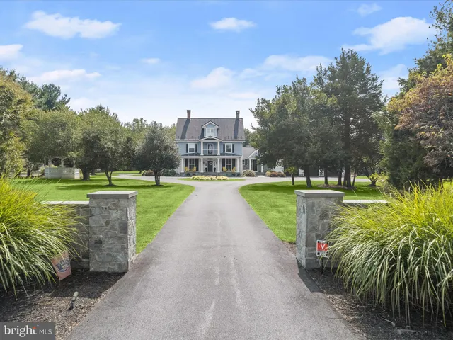 a view of a big yard with large trees and a big yard