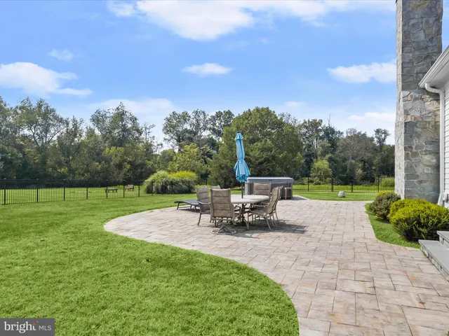 a aerial view of a house with backyard