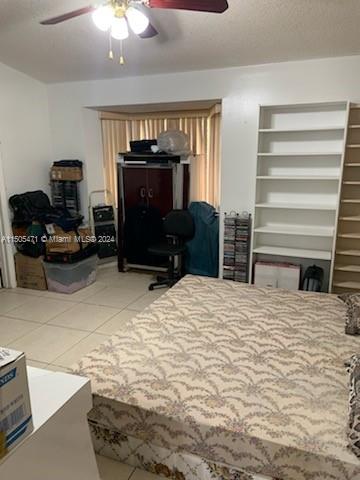 11861 Southwest 18th Street, Unit 329 Miami, FL 33175 - Photo 11 of 23 a bedroom with a bed and a television