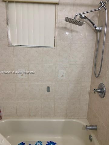 11861 Southwest 18th Street, Unit 329 Miami, FL 33175 - Photo 17 of 23 a bathroom with a shower and a bath tub