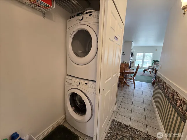a view of a hallway with washer and dryer