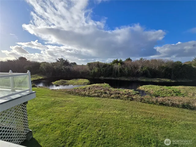 a view of a garden with an outdoor seating