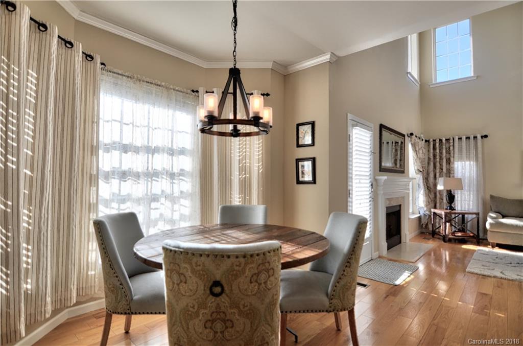 10435 Blackstock Road Huntersville, NC 28078 - Photo 12 of 33 a view of a dining room with furniture window and wooden floor
