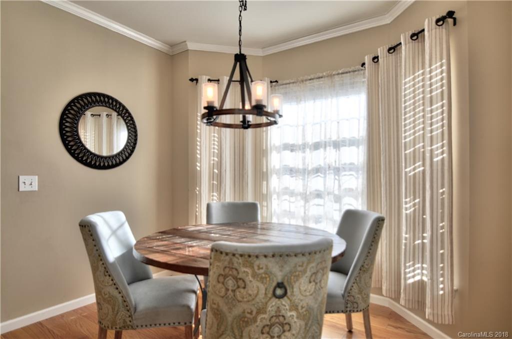 10435 Blackstock Road Huntersville, NC 28078 - Photo 13 of 33 a view of a dining room with furniture window and wooden floor