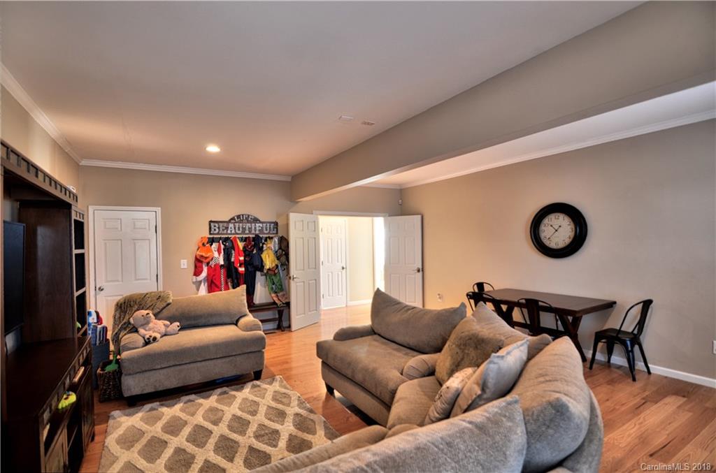 10435 Blackstock Road Huntersville, NC 28078 - Photo 16 of 33 a living room with furniture and a flat screen tv