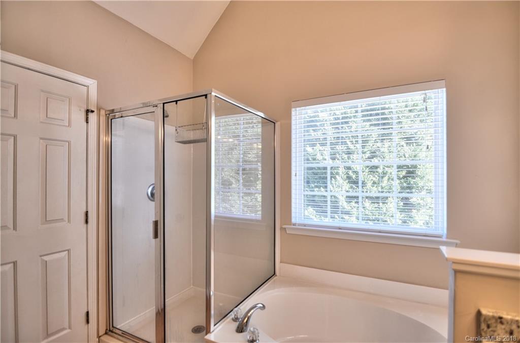 10435 Blackstock Road Huntersville, NC 28078 - Photo 24 of 33 a bathroom with a shower and a window
