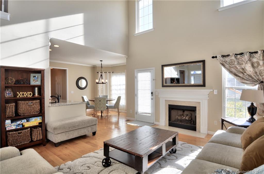 10435 Blackstock Road Huntersville, NC 28078 - Photo 4 of 33 a living room with furniture and a fireplace