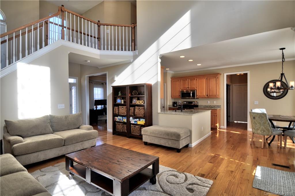 10435 Blackstock Road Huntersville, NC 28078 - Photo 5 of 33 a living room with furniture and wooden floor