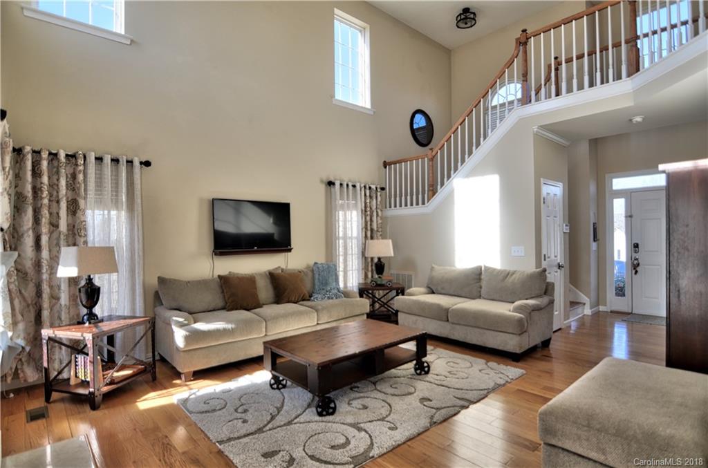 10435 Blackstock Road Huntersville, NC 28078 - Photo 6 of 33 a living room with furniture and a rug