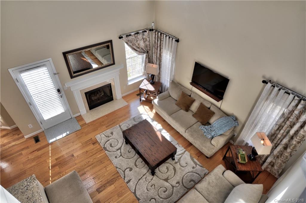 10435 Blackstock Road Huntersville, NC 28078 - Photo 7 of 33 a living room with furniture and a flat screen tv