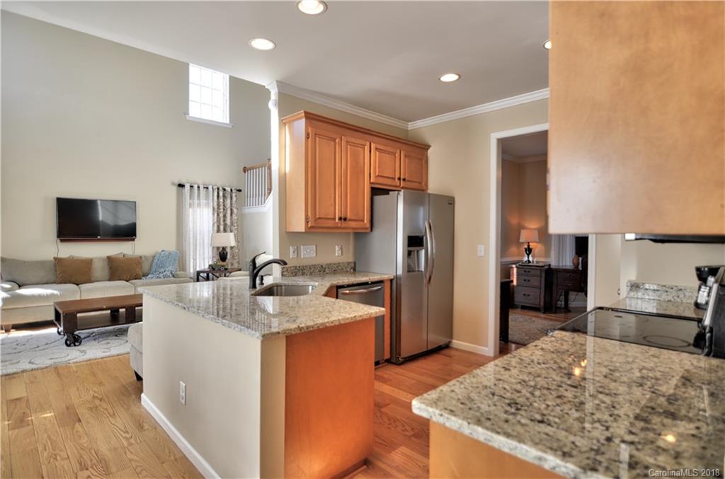 10435 Blackstock Road Huntersville, NC 28078 - Photo 8 of 33 a kitchen with refrigerator and furniture