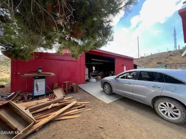 a view of a car parked in front of a house
