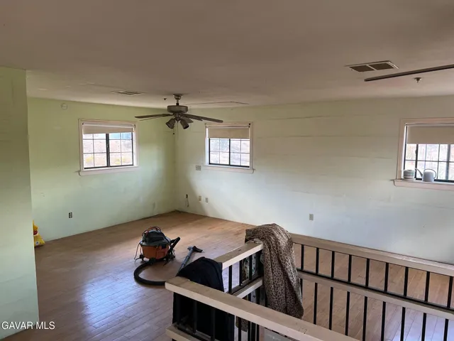 a bedroom with furniture and window