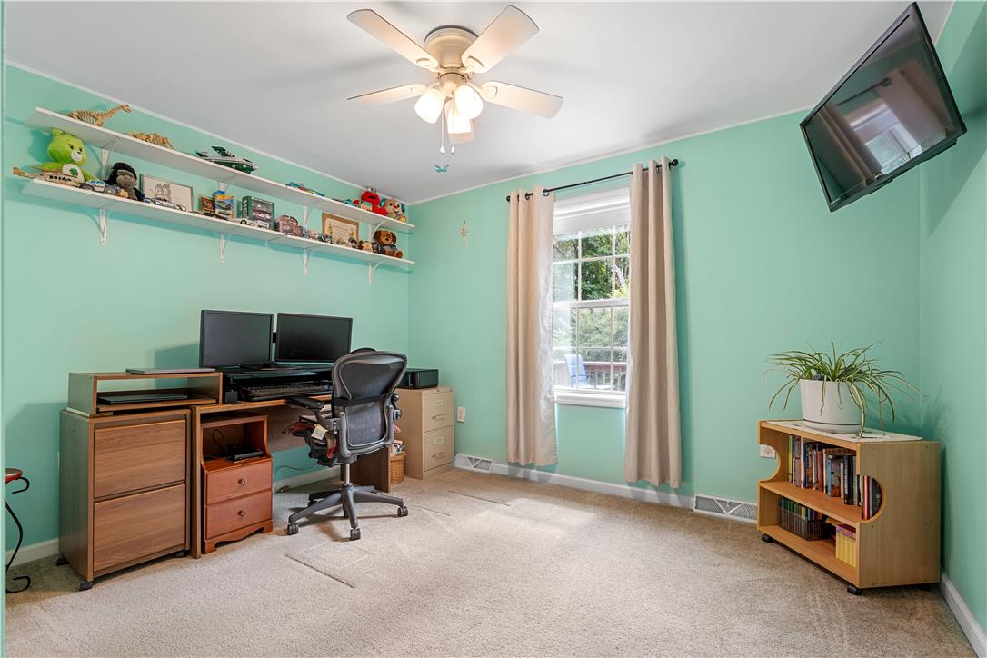 7353 Farrier Road Orefield, PA 18069 - Photo 43 of 74 Plentiful natural light streams through a classic sash window over soft wall-to-wall carpeting.