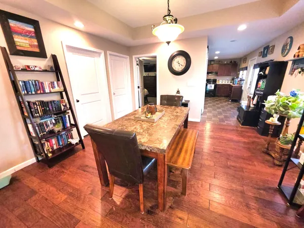 a view of a dining room with furniture and a table