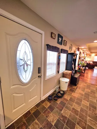 a view of kitchen with furniture and wooden floor