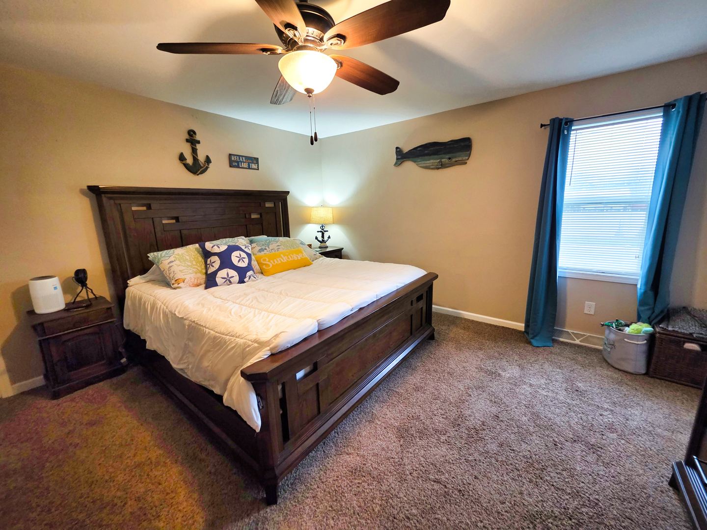 127 Flora Avenue Flora, IL 62839 - Photo 45 of 88 a bed sitting in a room with furniture and a ceiling fan