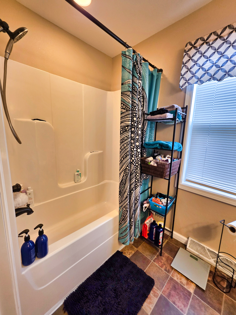 127 Flora Avenue Flora, IL 62839 - Photo 49 of 88 a bathroom with a tub and a shower