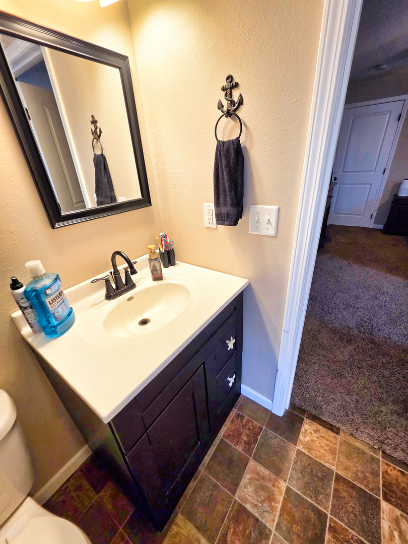 127 Flora Avenue Flora, IL 62839 - Photo 53 of 88 a bathroom with a sink and a mirror