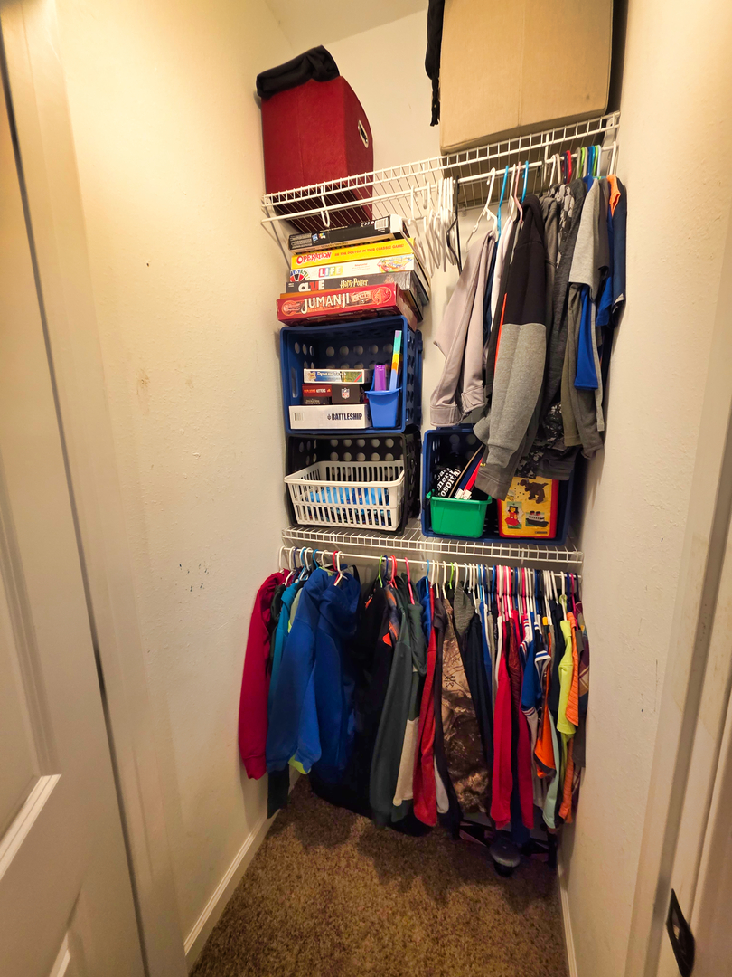 127 Flora Avenue Flora, IL 62839 - Photo 59 of 88 a view of walk in closet with clothes and shoes