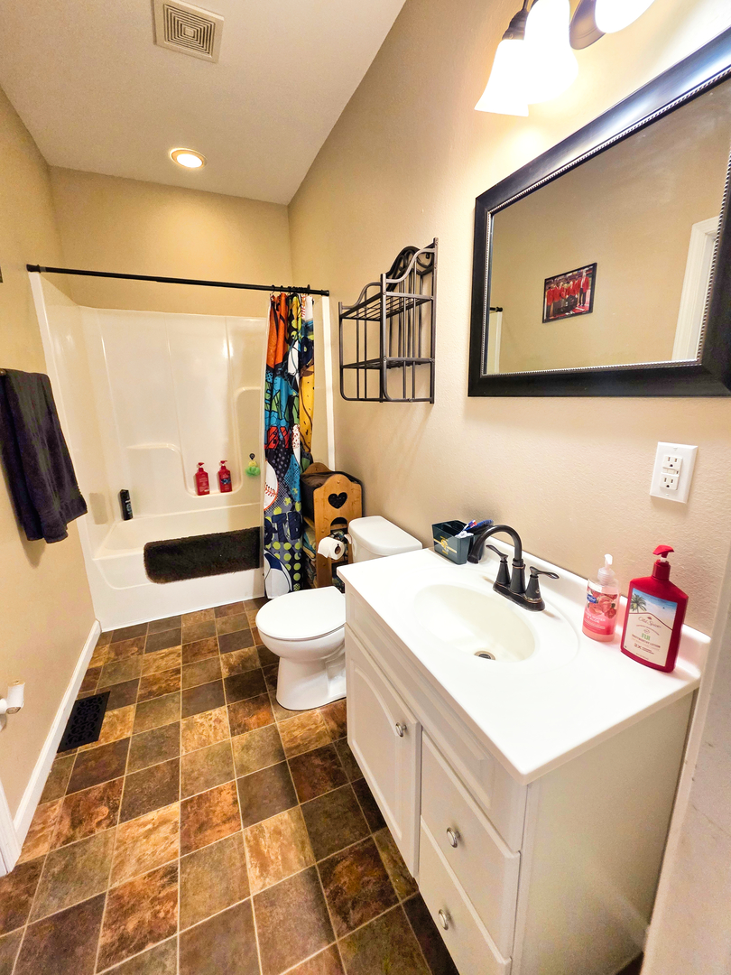 127 Flora Avenue Flora, IL 62839 - Photo 69 of 88 a bathroom with a sink mirror and toilet