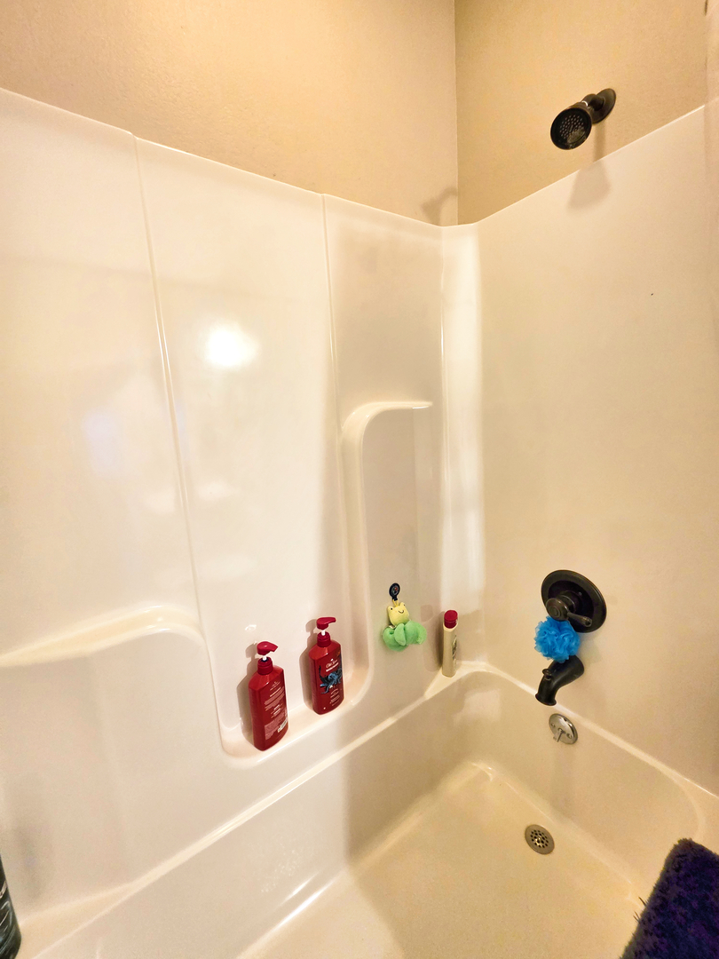 127 Flora Avenue Flora, IL 62839 - Photo 71 of 88 a bathroom with a tub and a shower