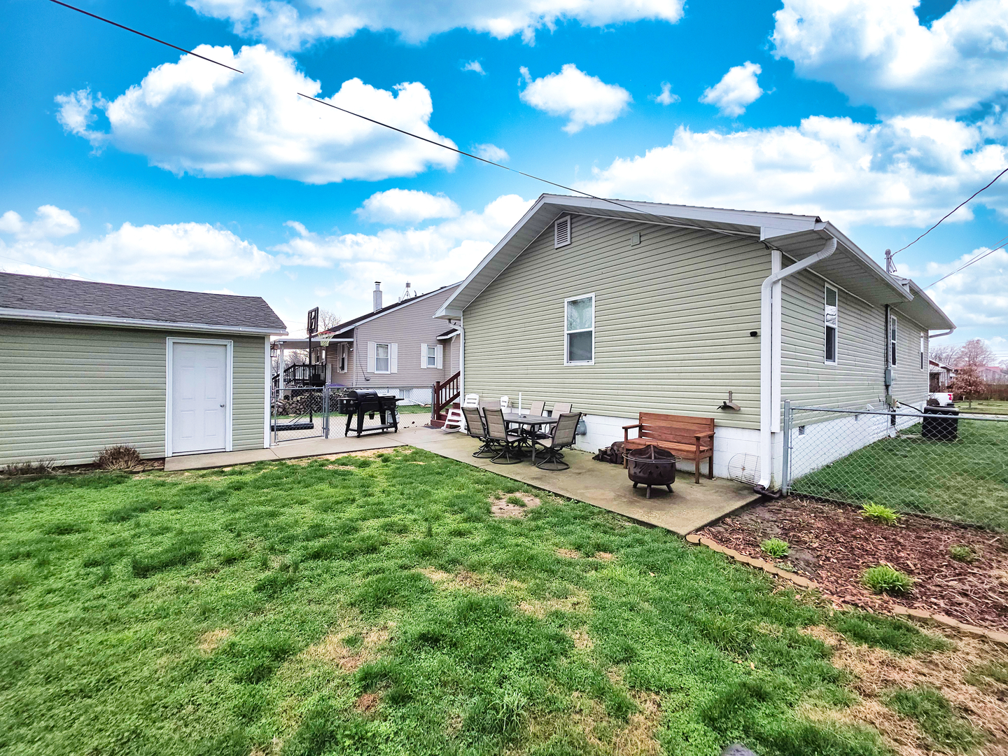 127 Flora Avenue Flora, IL 62839 - Photo 9 of 88 a backyard of a house with table and chairs