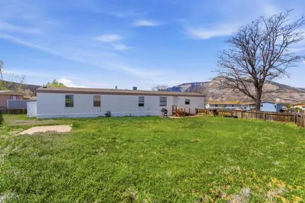a view of a house with a big yard