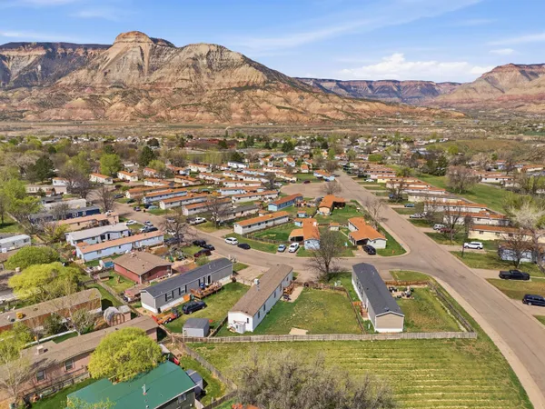 an aerial view of residential houses with outdoor space