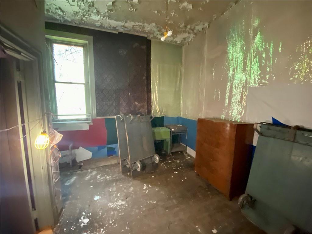 812 Concord Street Pittsburgh, PA 15212 - Photo 10 of 18 a living room with furniture and a window