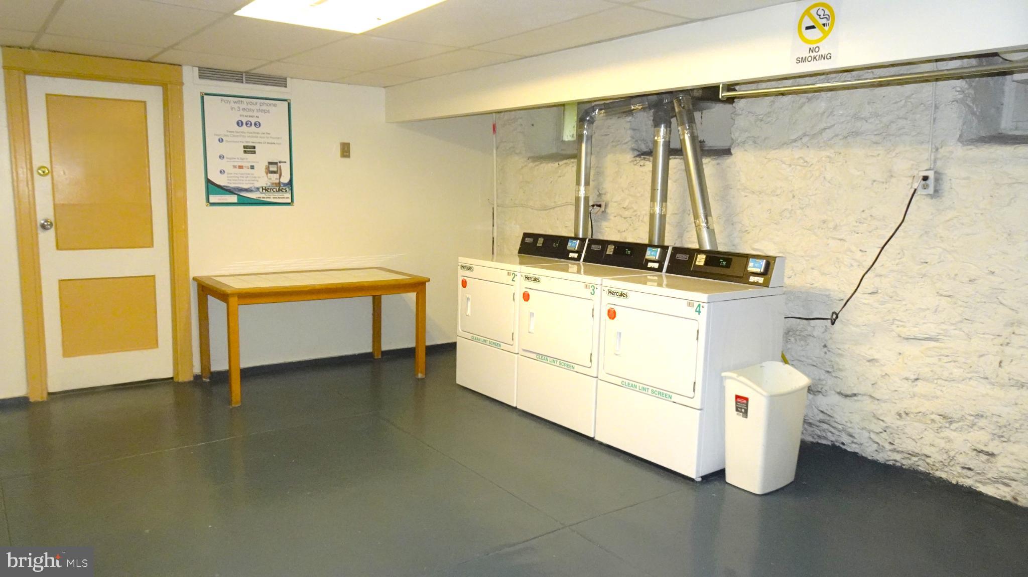 7876 Spring Avenue, Unit 3D Elkins Park, PA 19027 - Photo 13 of 14 Bright and functional laundry space.