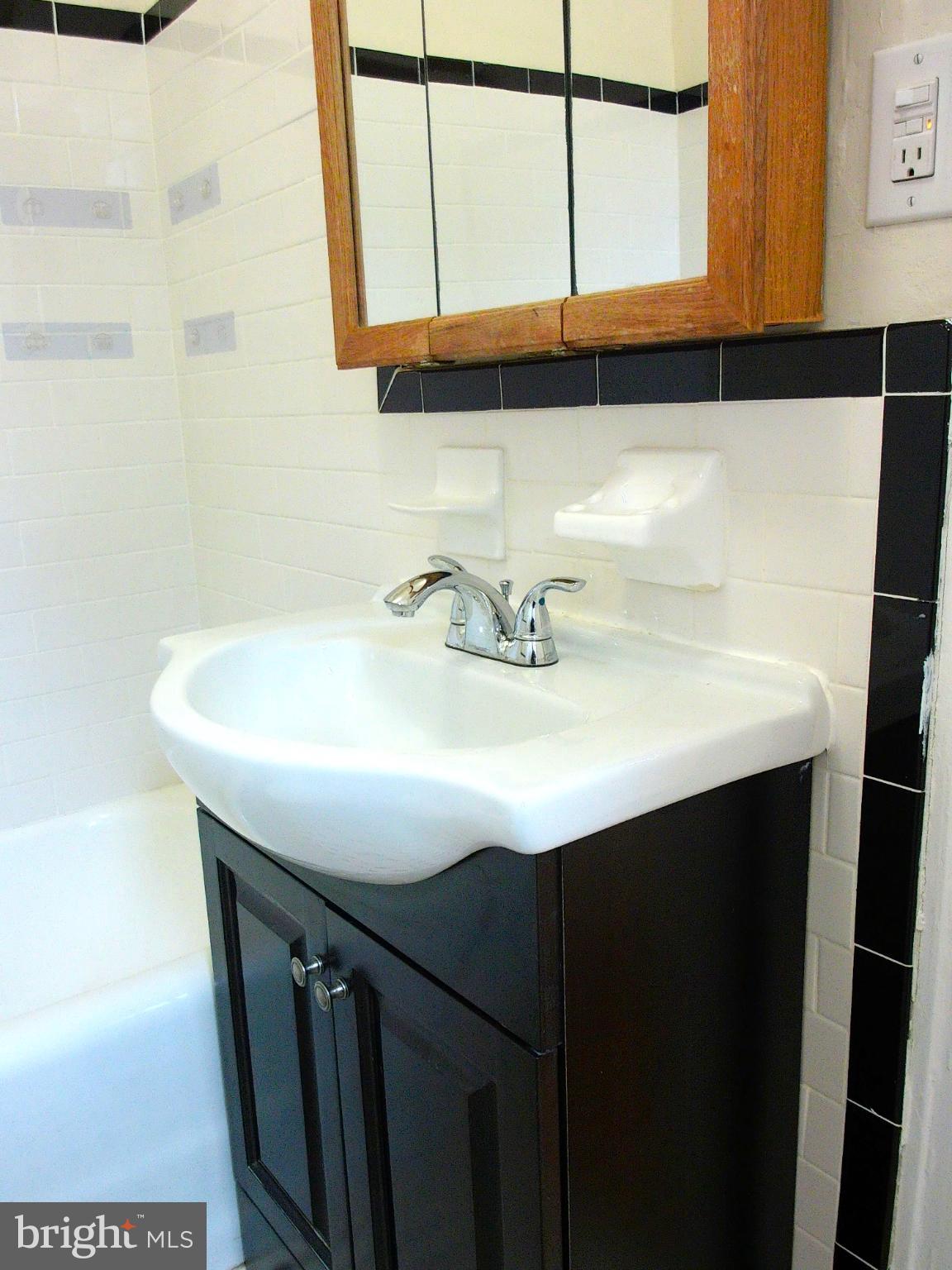 7876 Spring Avenue, Unit 3D Elkins Park, PA 19027 - Photo 14 of 14 Bathroom with modern fixtures.