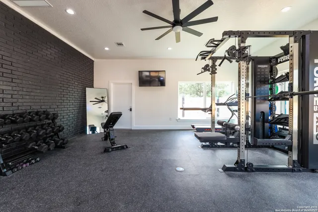 a view of room with furniture and flat screen tv