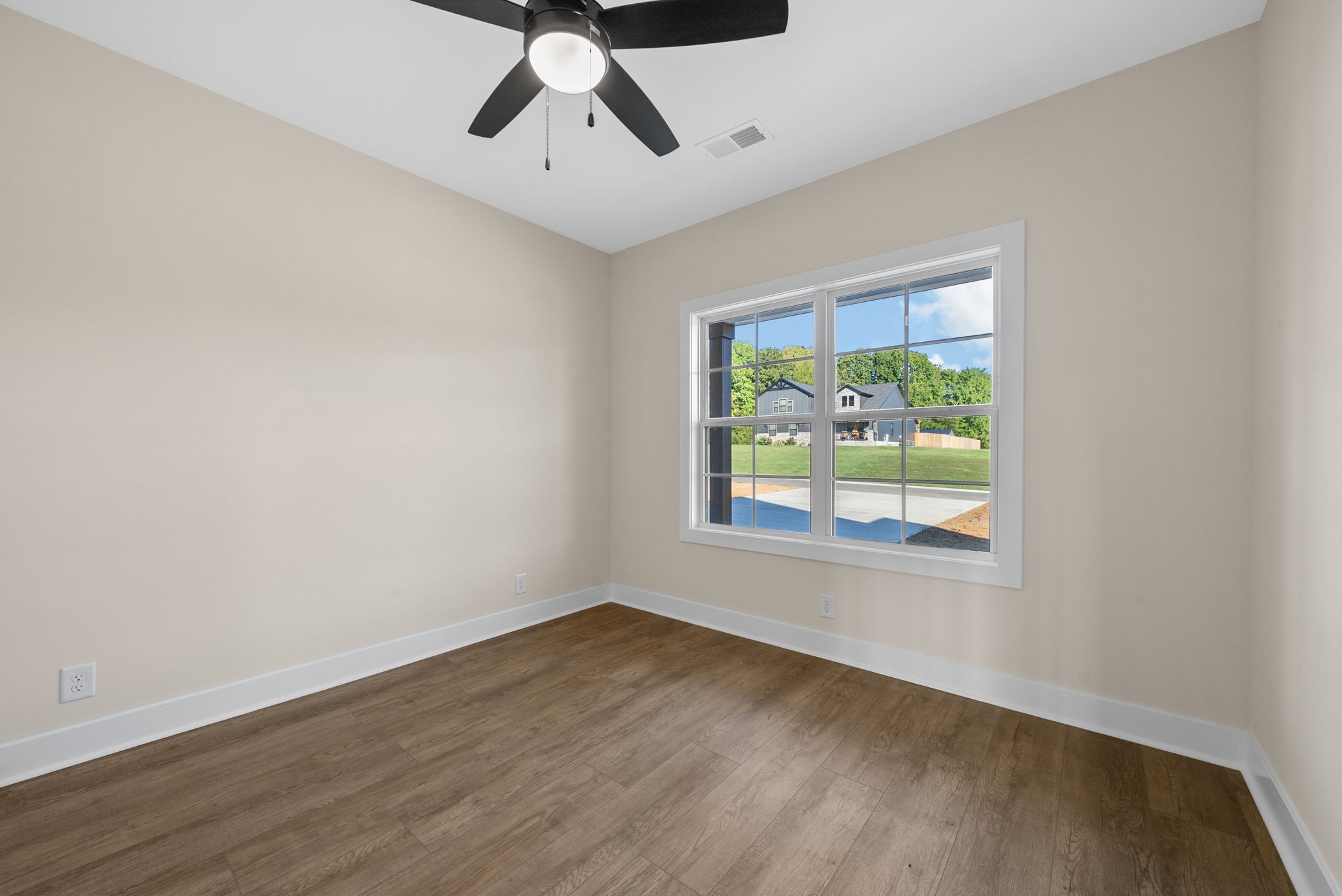 3860 Chapel Hill Road Clarksville, TN 37040 - Photo 27 of 38 a view of an empty room with wooden floor and a window
