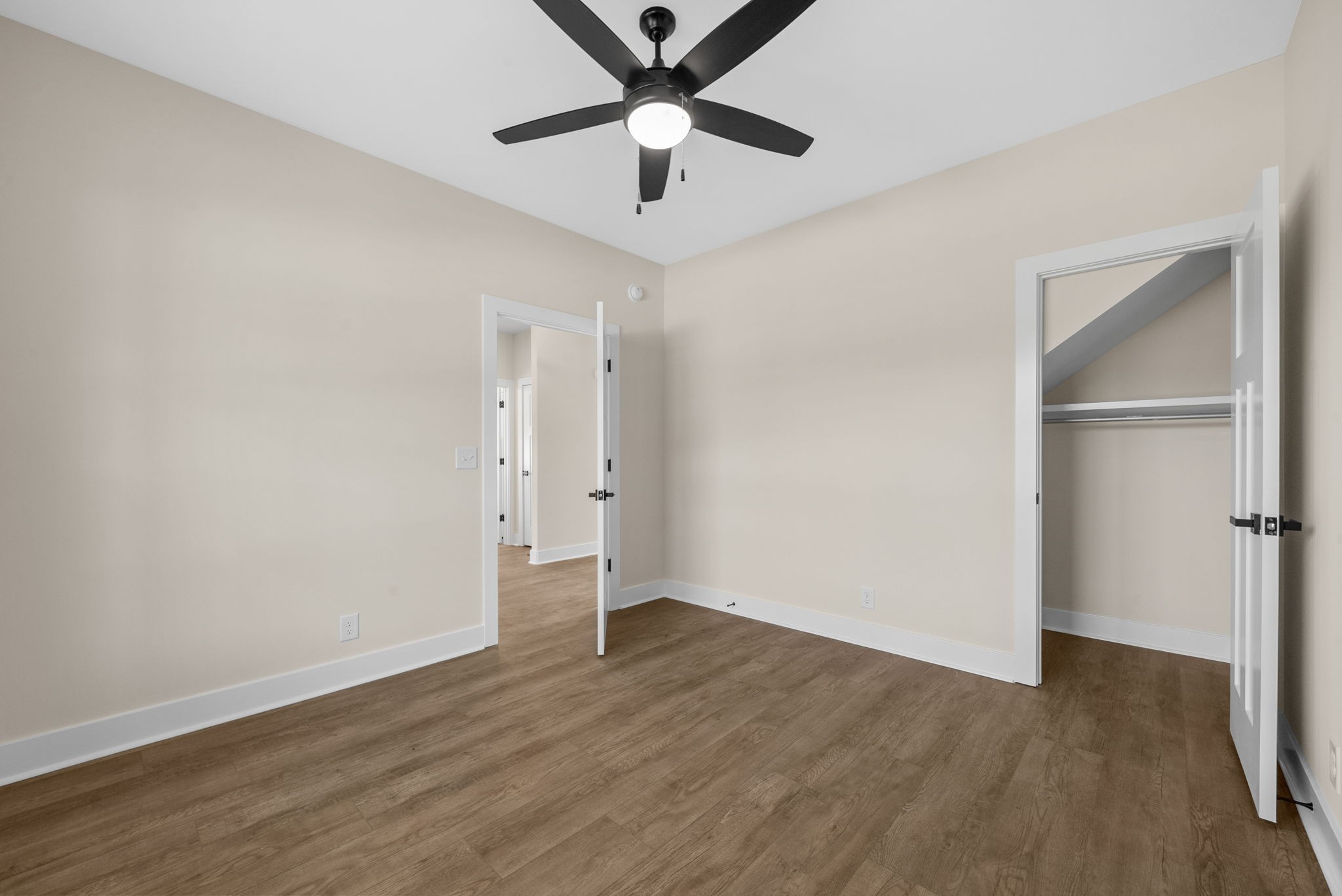 3860 Chapel Hill Road Clarksville, TN 37040 - Photo 28 of 38 a view of a room with wooden floor and a ceiling fan
