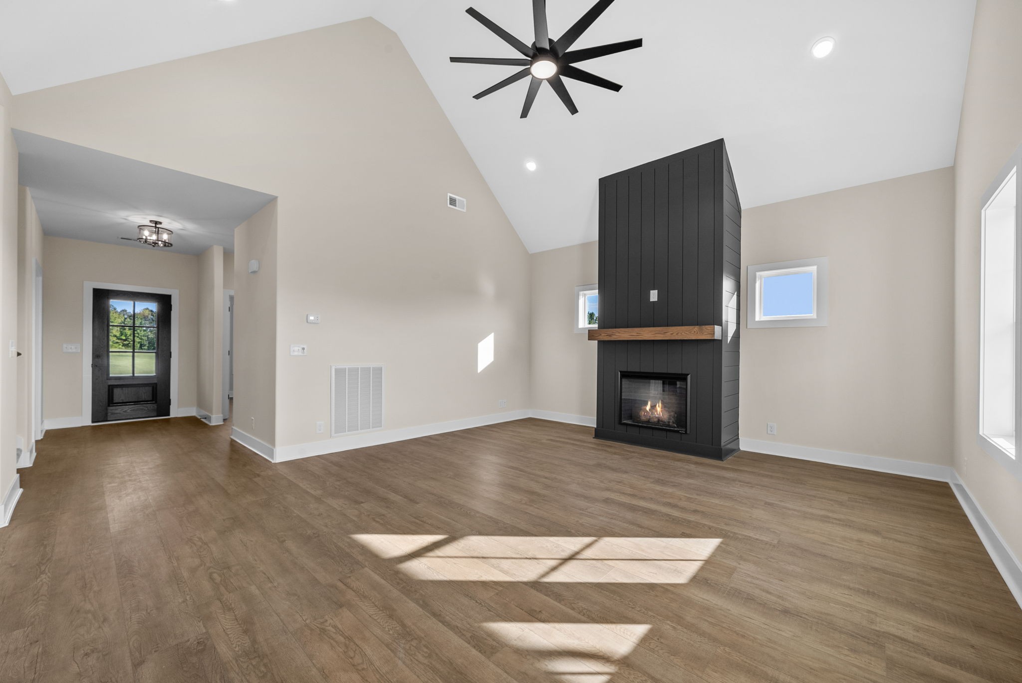 3860 Chapel Hill Road Clarksville, TN 37040 - Photo 3 of 38 a view of an empty room with wooden floor and a fireplace