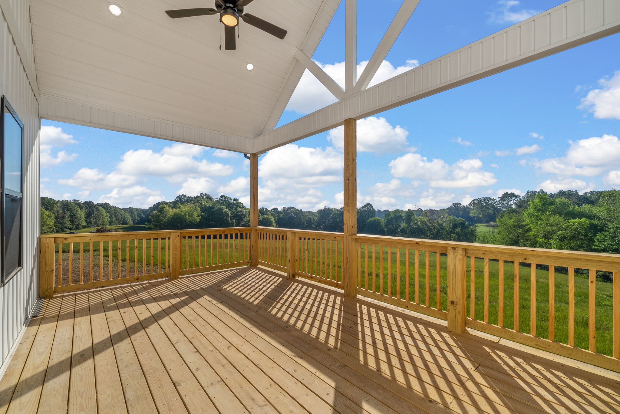 3860 Chapel Hill Road Clarksville, TN 37040 - Photo 34 of 38 a view of balcony with couch and wooden floor