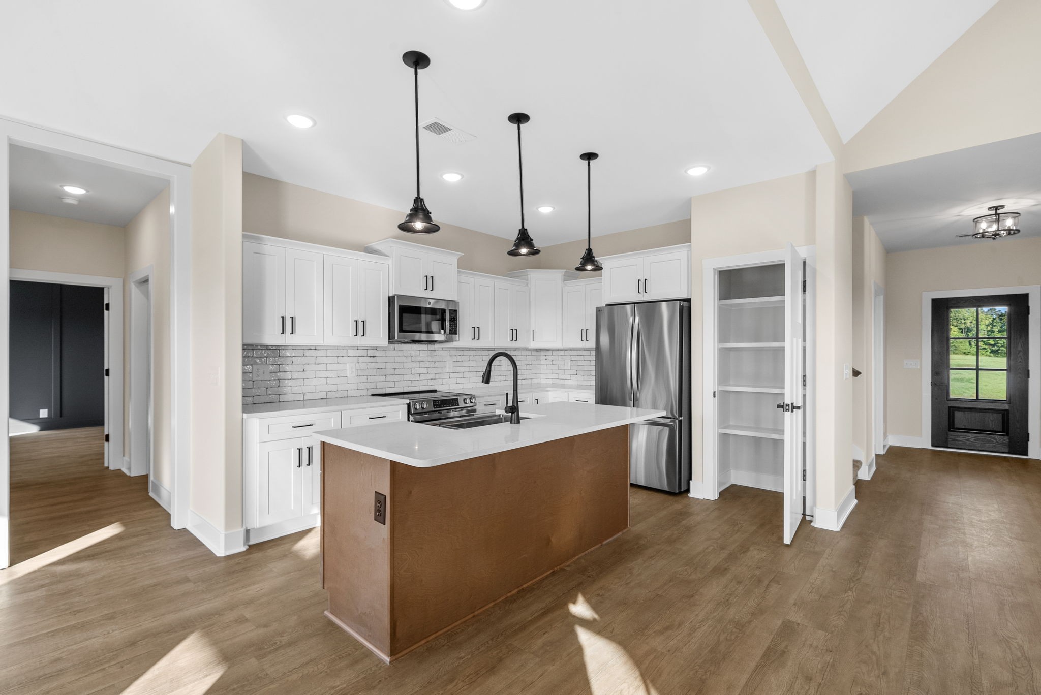 3860 Chapel Hill Road Clarksville, TN 37040 - Photo 6 of 38 a kitchen with stainless steel appliances granite countertop a sink a refrigerator and a stove