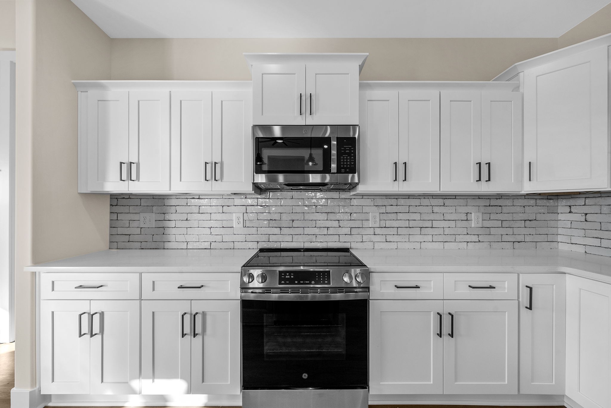 3860 Chapel Hill Road Clarksville, TN 37040 - Photo 7 of 38 a kitchen with white cabinets and black appliances