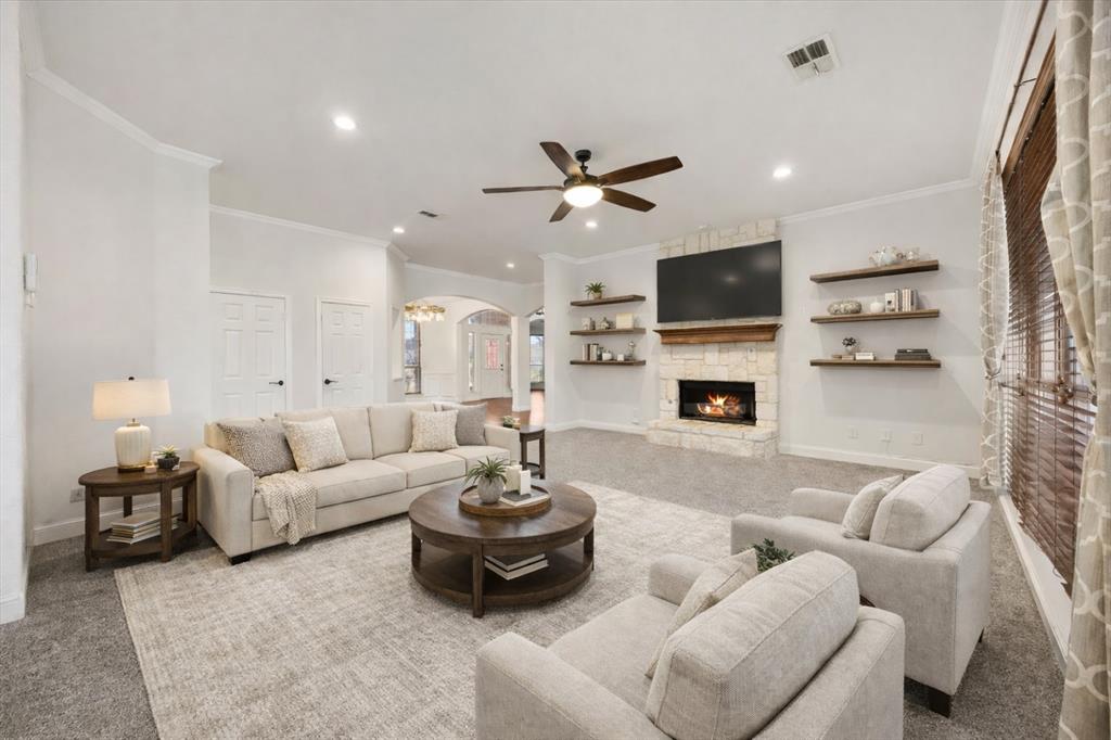 9398 Blarney Stone Way Forney, TX 75126 - Photo 11 of 38 a living room with furniture fireplace and a flat screen tv