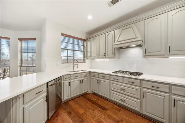 a kitchen with sink cabinets and window