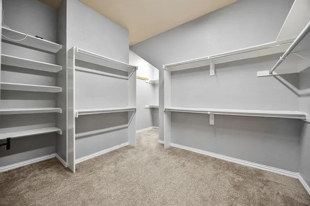 a view of an empty walk in closet