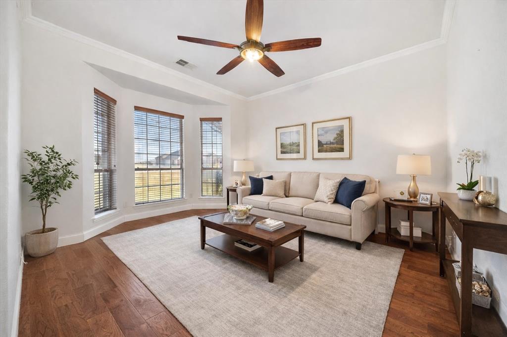 9398 Blarney Stone Way Forney, TX 75126 - Photo 21 of 38 a living room with furniture and a large window