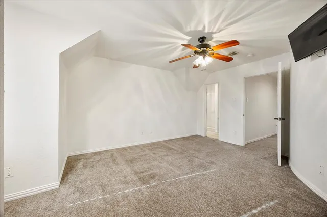 a view of a chandelier fan in a room