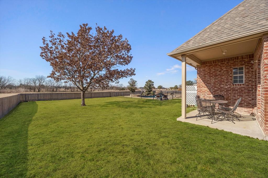 9398 Blarney Stone Way Forney, TX 75126 - Photo 35 of 38 a view of a playground with a slide