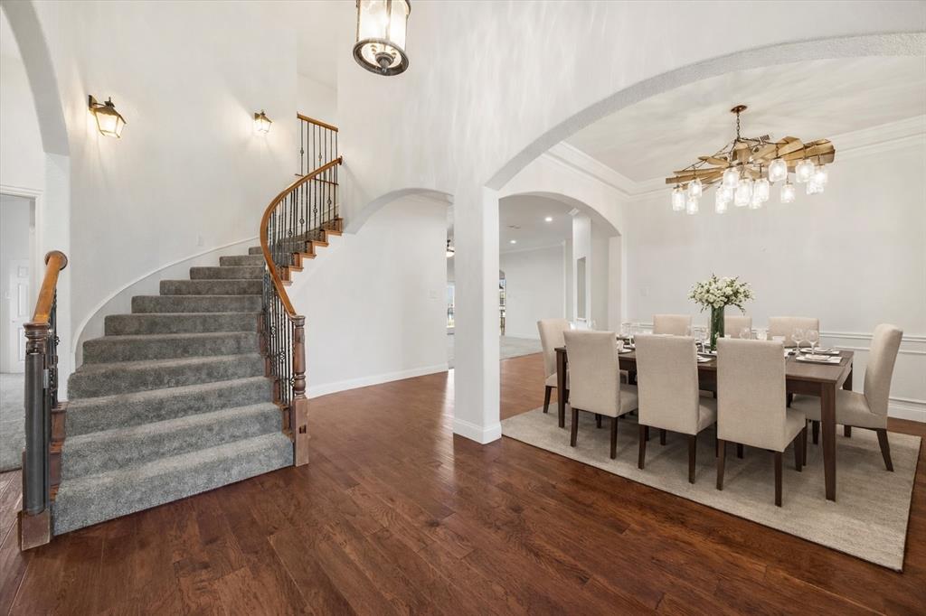 9398 Blarney Stone Way Forney, TX 75126 - Photo 6 of 38 a view of a dining room with furniture and wooden floor