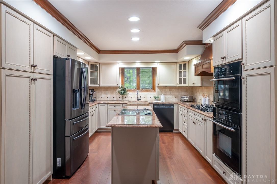 273 North Alpha Bellbrook Road Dayton, OH 45434 - Photo 13 of 43 This spacious kitchen offers a central island, ample cabinetry, and modern appliances for culinary pursuits.