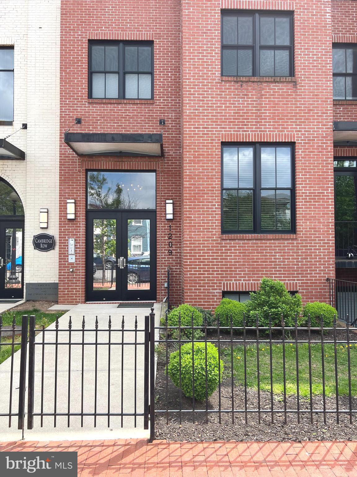 1209 G Street Southeast, Unit 8 Washington, DC 20003 - Photo 2 of 27 a front view of a house with a garden