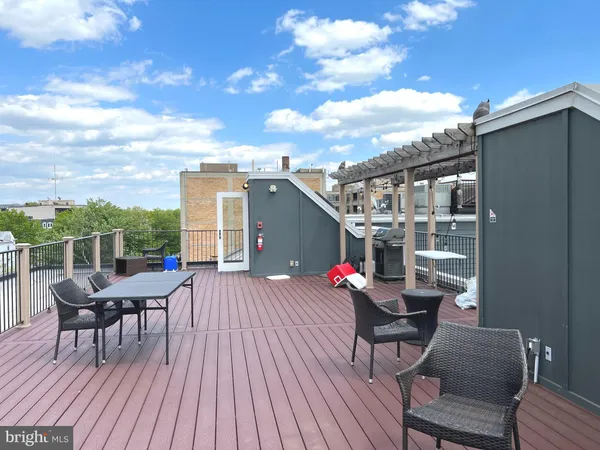 a roof deck view with a seating space