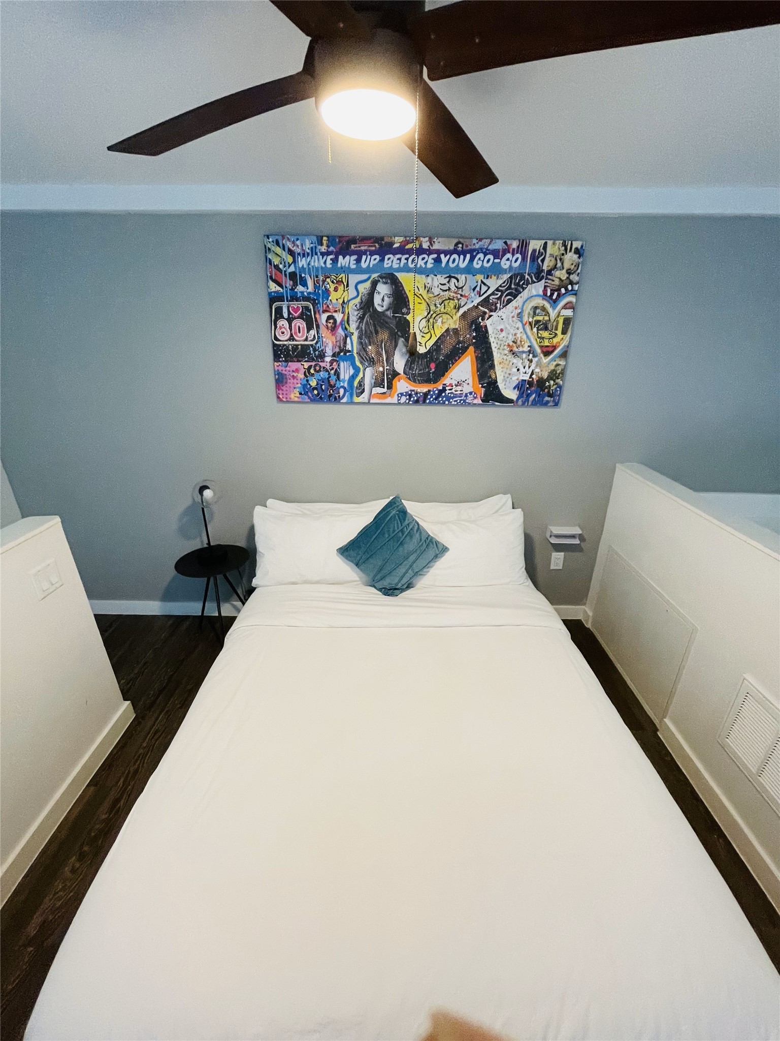 49 Navasota Street, Unit 201 Austin, TX 78702 - Photo 8 of 13 a bedroom with a bed and painting on the wall